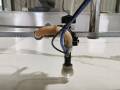 Flow Mach 200 waterjet with vacuum assisted piercing head 